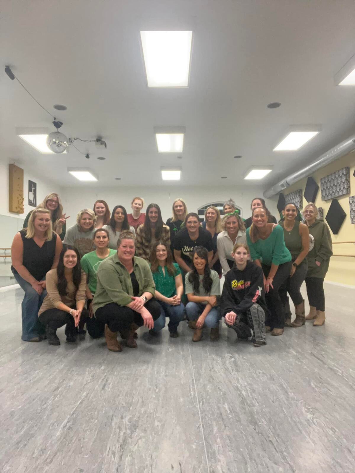 Group of women smiling together in the dance studio after a Boots and Starz line dancing class